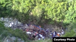 The bus, which was mostly carrying university students, fell off a cliff some 200 kilometers south of Tirana. 