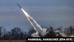 Ukrainian troops fire a HIMARs missile close to the front line in the Kherson region on November 5.
