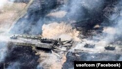 Подрыв моста во время движения российской военной техники в сторону города Изюм Харьковской области. Фото опубликовано Минобороны Украины 14 апреля 2022 г.