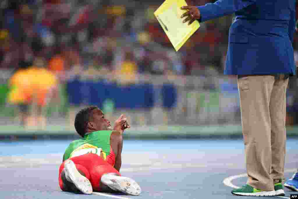 Grenada's Bralon Taplin reacts after competing in the men's 400-meter semifinal during the athletics event at the Olympic Stadium.