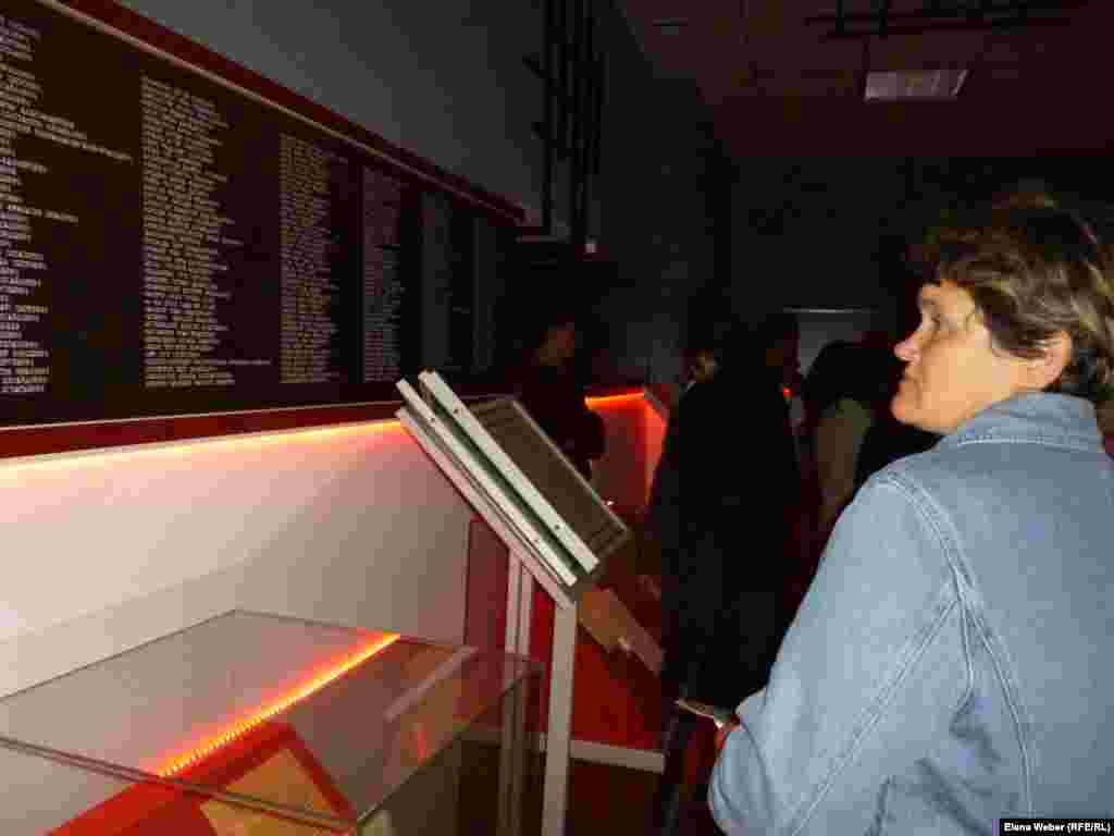 In the Hall of Remembrance, a visitor reads about those who died in the KarLAG.