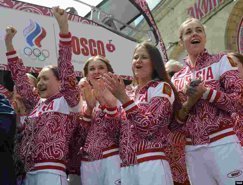 Russian synchronized swimmers show off one of the uniforms designed by Moscow's Bosco di Ciliegi label.
