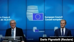 BELGIUM -- European Commission President Jean-Claude Juncker (L) and EU Council President Donald Tusk hold a joint news conference during a European Union leaders summit meeting in Brussels, October 20, 2017