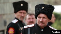 Cossacks stand guard near the Crimean parliament building in Simferopol in March 2014 as Russia was taking over the region from Ukraine.