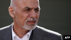 Afghan President Ashraf Ghani makes a brief statement to the news media before starting talks at Camp David in Camp David, Maryland, on March 23.