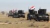 Iraq -- Iraqi Anti-terror forces drive down a road during an operation aimed at retaking areas from the Islamic State (IS) jihadist group, in the desert of Samarra, March 2, 2016