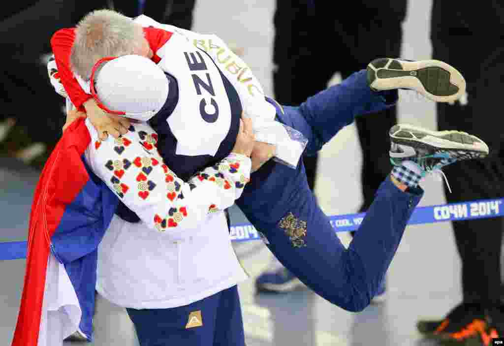 Silver medallist Martina Sablikova (right) of the Czech Republic celebrates with her coach Petr Novak after the women&#39;s 3000-meter speed-skating event in Adler Arena.