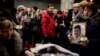 Mourners attend memorial services for five rescue workers and a miner killed in one of a series of mine explosions in Vorkuta.