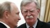 Russian President Vladimir Putin (left) meets with U.S. national-security adviser John Bolton in Moscow on October 23. 