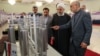 President Hassan Rouhani inspecting nuclear technology with the head of Iran's Atomic Energy Organization, as Iran marks National Nuclear Technology Day, April, 2019.