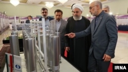 President Hassan Rouhani inspecting nuclear technology with the head of Iran's Atomic Energy Organization, as Iran marks National Nuclear Technology Day, April, 2019.