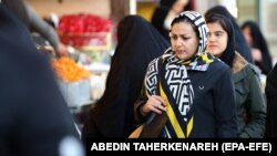 IRAN -- An Iranian woman looks at goods displayed in a shop in Molavi old bazaar in Tehran, Iran, 04 March 2019