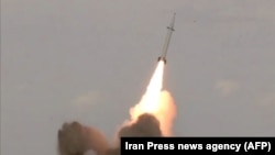 A short-range ballistic missile is test-launched by Iran's Islamic Revolutionary Guards Corps.