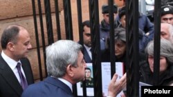 Armenia -- President Serzh Sarkisian talks to protesting parents of soldiers who died in non-combat incidents, 27Jan2011.