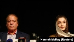 Ousted Prime Minister Nawaz Sharif appears with his daughter, Maryam, at a news conference in London in July.