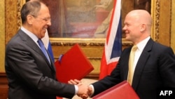 British Foreign Secretary William Hague (right) and Russian counterpart Sergei Lavrov today in London