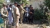 Security forces investigate an explosion that killed Abdul Jabar Qahraman, a candidate in parliamentary elections, at his home in Lashkar Gah, the capital of the southern Helmand Province, on October 17, 2018.
