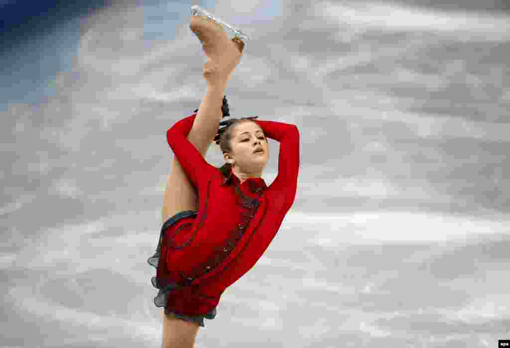 Russia's Yulia Lipnitskaya performs during the women's free skating team event. (EPA/Barbara Walton)