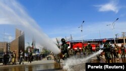 Afghan National Army (ANA) soldiers spray disinfectant in the eastern city of Jalalabad to prevent the spread of the coronavirus disease (COVID-19) on April 9.