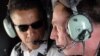 Iraq - US General David Petraeus (R) talking with US Democratic presidential candidate Barack Obama (L) as they fly over Baghdad during a helicopter tour, 21Jul2008