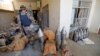 A member of the Iraqi counterterrorism forces stands by an Islamic State weapons factory in Fallujah on June 23.