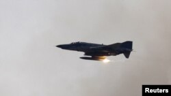 Turkey -- A Turkish Air Force F-4 war plane fires during a military exercise in Izmir, 26May2010