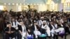 FILE: A gathering in the southern Afghan city of Kandahar in April.