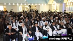 FILE: A gathering in the southern Afghan city of Kandahar in April.