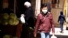 Syria: boy walking with mask