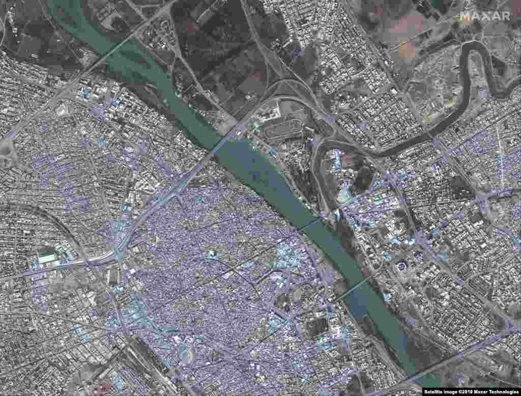 These satellite images show Mosul, Iraq on November 13, 2015, before IS militants invaded the city and the same area on July 8, 2017, after IS destroyed much of this part of the city.
