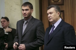 Former Ukrainian President Viktor Yanukovych (right) and his son Viktor in Kyiv in 2008