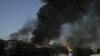 Pakistani firemen extinguish a fire on a burning oil tanker on a highway near Shikarpur, Pakistan, on October 1.
