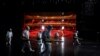 Volunteers from the Blue Sky Rescue team disinfect at the Qintai Grand Theatre in Wuhan, April 2, 2020