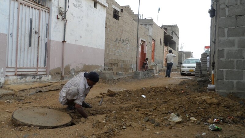Pakistani Slum Takes On Sewer Problem