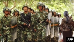 Chinese riot police on the streets of Urumqi