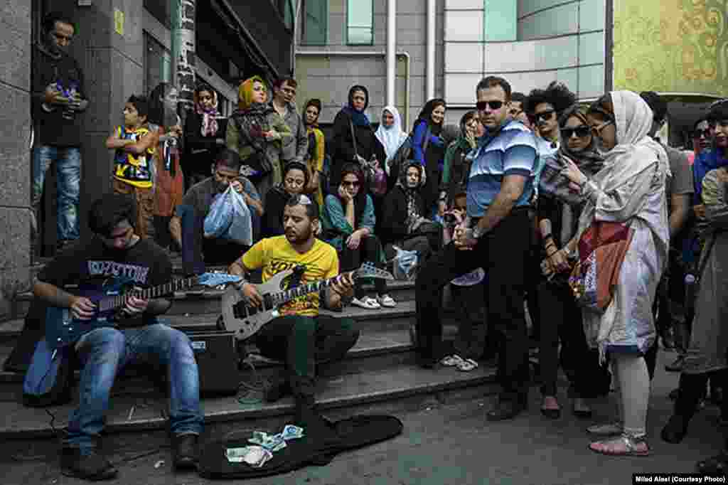 Alaei&#39;s series of photos of street musicians were published by the Fars news agency. But in this photo, the two women on the right side were considered to be insufficiently veiled. Alaei&#39;s editors said the photo could be published only if the women were cropped out of the image.