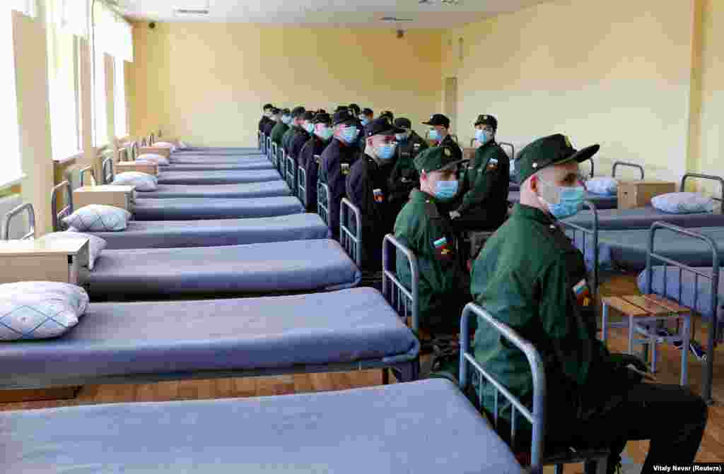 Russian conscripts sit next to their beds at a recruiting station in Kaliningrad, Russia. (Reuters/Vitaly Nevar)