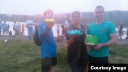 Ilya Drobyshev (left) with his mother and older brother.