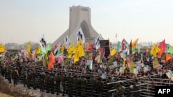 Demonstrators hold anti-U.S. slogans and portraits of Supreme Leader Ayatollah Ali Khamenei during a rally in Tehran's Azadi Square (Freedom Square) to mark the 35th anniversary of the Islamic revolution on February 11.