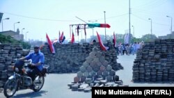 Piles of pavement stones block the street near Rabia al-Adawiya Mosque, which has become the main protest site of the supporters of deposed Egyptian President Muhammad Morsi, in Cairo.