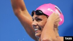 Russia's Yulia Yefimova waves after finishing in a women's 100m breaststroke heat at the 16th FINA World Championships in Kazan.