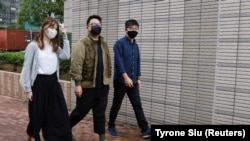 Activiștii pro-democrație Ivan Lam, Joshua Wong și Agnes Chow