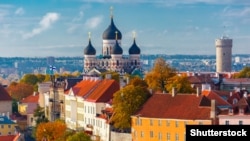 Estonia -- Stock Photo: Toompea hill with tower Pikk Hermann and Russian Orthodox Alexander Nevsky Cathedral, view from the tower of St. Olaf church, Tallinn, Estonia Image ID:331780052 Copyright: kavalenkava volha