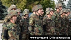 Moldovan soldiers stand in formation in Chisinau before their departure for the Rapid Trident maneuvers in Ukraine in September 2017.