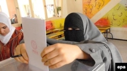 A woman casts a ballot at a polling station in Sale, Morocco, in 2007.