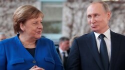 Angela Merkel i Vladimir Putin (fotoarhiv)