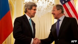 U.S. Secretary of State John Kerry (left) shakes hands with Russian Foreign Minister Sergei Lavrov in Paris in March 2014.