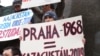 Kazakh asylum seekers holding a protest last month in Prague against their possible deportation from the Czech Republic. They say they would face persecution for their religious beliefs if they return to Kazakhstan.