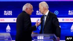 Претенденты на выдвижение кандидатом в президенты США от Демократической партии Берни Сандерс (слева) и Джо Байден.
