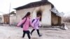 Children walk past a burned-out house in the village of Masanchi, Zhambyl region. February 26, 2020.<br />
Дети идут мимо сгоревшего дома в селе Масанчи, Жамбылская область. 26 февраля 2020 года.